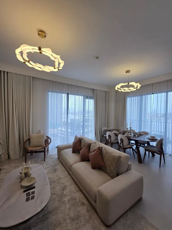 Furnished three-bedroom living and dining by Nuwah Interiors